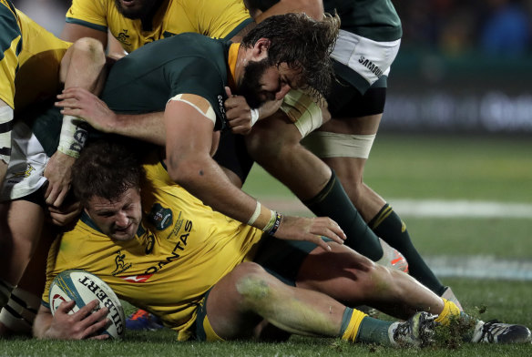 James Slipper, bottom, is tackled by South Africa's Lood de Jager,