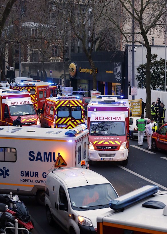 Police, paramedics and firefighters at the scene of the shooting in the south Paris on Thursday, January 8. 