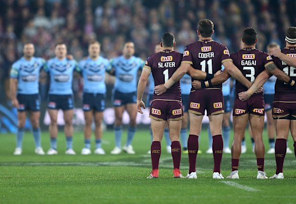 Teams sing the national anthem 
