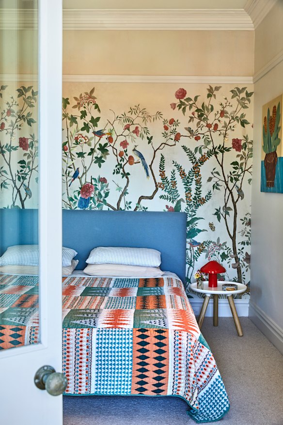 A balcony off the main bedroom offers light, as well as sea views. The bedspread is by Donna Wilson, the bedside lamp by Hay and the wallpaper by Gucci. 