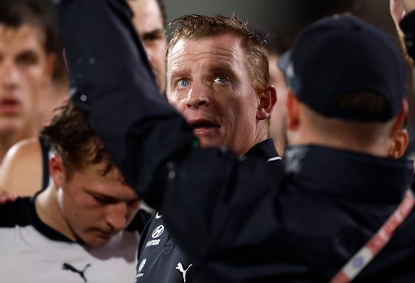 Bold call: Michael Voss addresses his troops in their clash with the Crows.