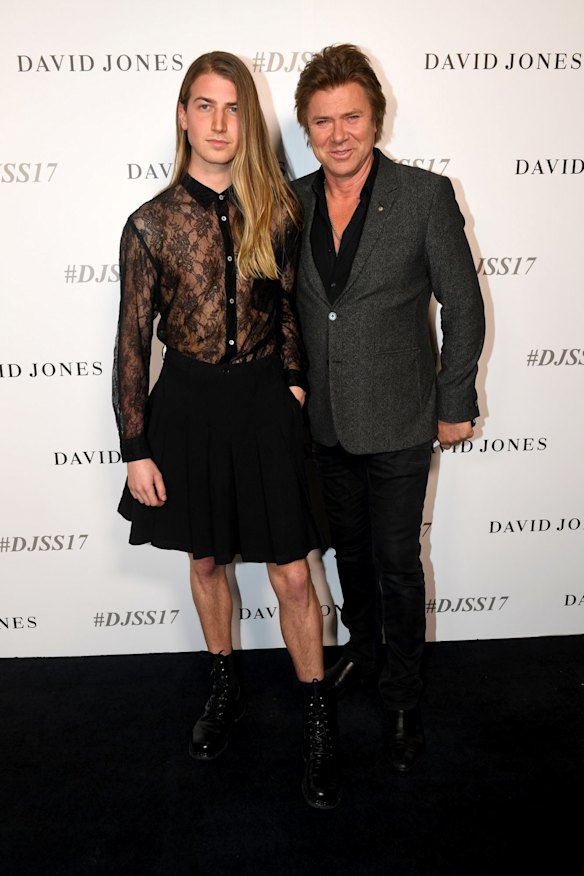 Christian Wilkins looking chic in a sheer, lace blouse and mini-skirt, alongside his father, Channel Nine entertainment editor, Richard Wilkins, at the David Jones show.