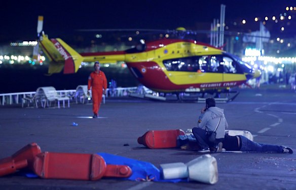 A helicopter prepares to evacuate the victims.
