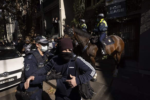 Police clash with protestors in Chippendale. With side roads blocked by mounted Police protestors made runs through Police lines in pitched violence through the suburb.
