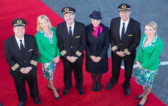 Flight attendants in original Qantas uniforms from the 1970s at the launch of the airline's new retro-livery on its latest Boeing 737 in 2014.