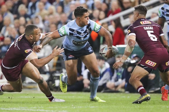 Latrell Mitchell with the ball.