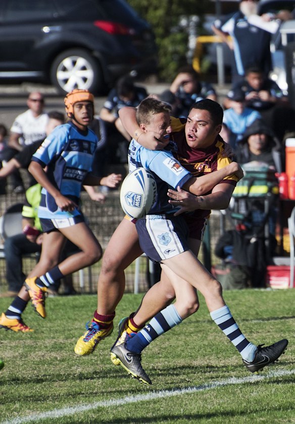 A clever offload by a Guildford Owls player.