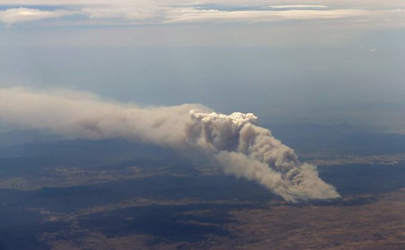 Smoke rises from the Yarrabin bushfire, burning out of control near Cooma, about 100km (62 miles) south of Canberra.