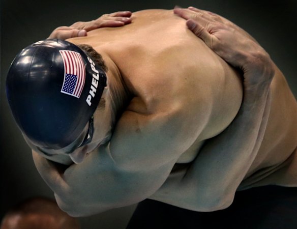 Michael Phelps stretches out ahead of a semi final race at the 2012 London Olympic Games.