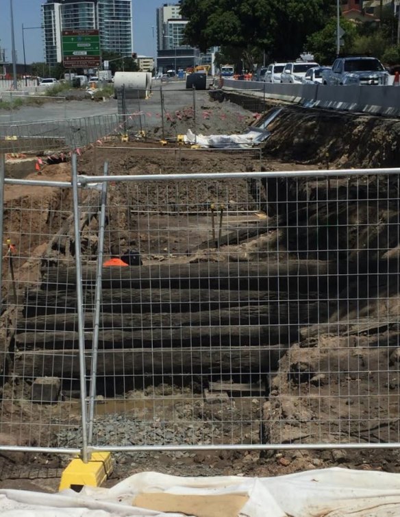 A pre-1860s timber bridge has been unearthed under Kingsford Smith Drive near Nudgee Road.