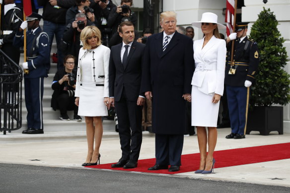 White lady... Melania Trump, right, with US president Donald Trump, French president, Emmanuel Macron, and his wife, Brigitte.
