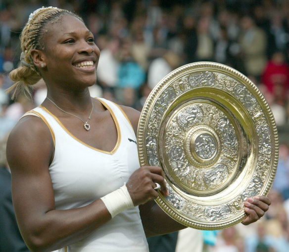 Serena Williams holds her trophy after winning her first Wimbledon title in 2002.