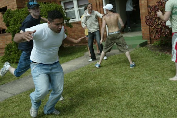 a white drunken  lynch  mob attack a man  in cronulla,   the mob  were looking for anyone of middle eastern appearence and then beating them.  pic andrew meares smh news