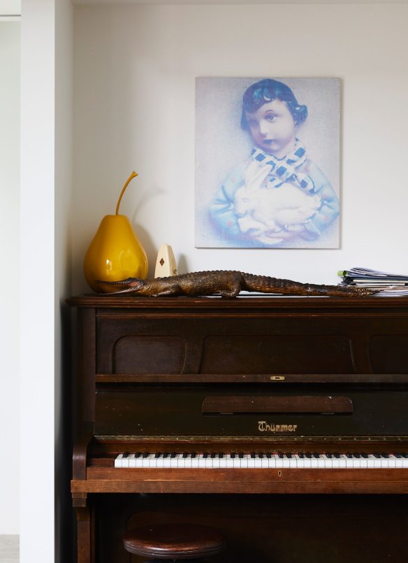 Rosa’s parents bought this piano with money given to them on their wedding day, and the crocodile is also a gift from Rosa’s mother. The artwork is a Kate Daw print on damask.