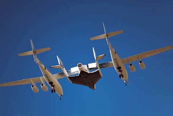 The first captive-carry flight of VSS Enterprise or SpaceShipTwo over Mojave, California. The center mounted spaceship is attached to the "mothership"  WhiteKnightTwo for a series of flight tests prior to its first drop test later in the year. 