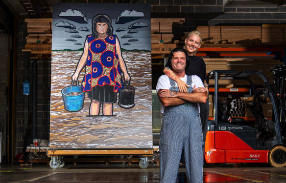 Blak Douglas and fellow artist Kim Leutwyler with his 2022 winning portrait of Karla Dickens in March.