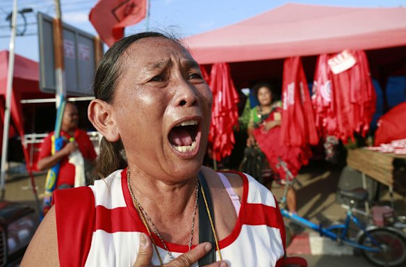A pro-government demonstrator shouts after  the coup.