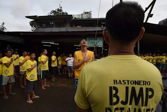 Inmates during a flag raising ceremony inside Quezon City Jail, Manila, Philippines.