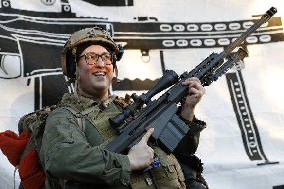 A demonstrator stands outside a security zone before a pro-gun rally in Richmond, Virginia.