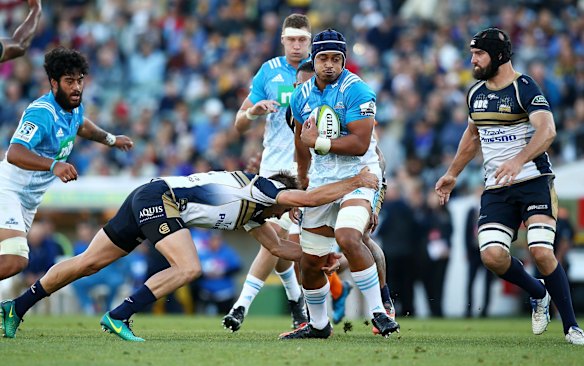 Gerard Cowley-Tuioti of the Blues is tackled.