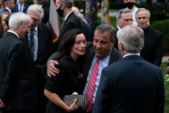 Chris Christie speaks with others after President Donald Trump announces Judge Amy Coney Barrett as his nominee to the Supreme Court.