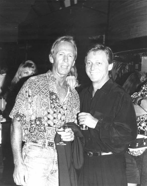 John Cornell and Paul Hogan mix with Byron Bay locals at the opening of Cornell's new Seaside Cafe. 6th December 1991.