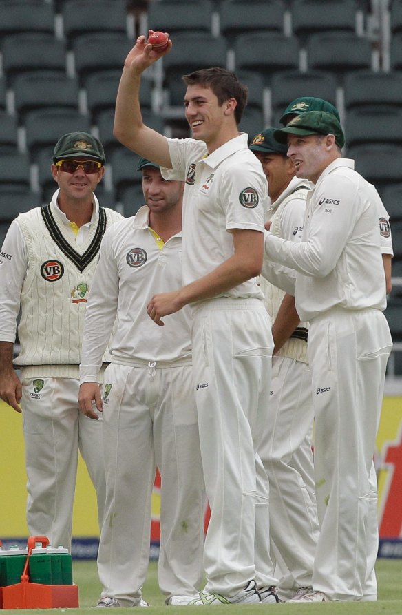 Playing with idols: Pat Cummins celebrates dismissing South Africa's Vernon Philander during his debut in 2011.