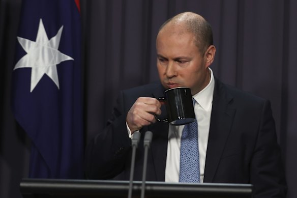 Treasurer Josh Frydenberg takes a sip of water while speaking about the National Accounts on Wednesday 2 June.