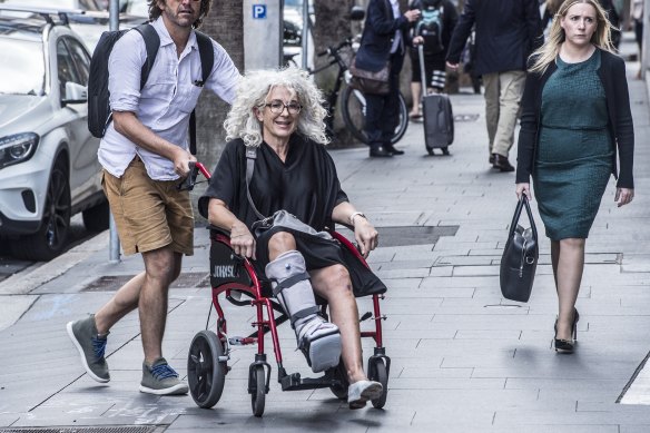 Eddie Obied’s barrister April Francis arrives at the Supreme Court in a wheelchair.