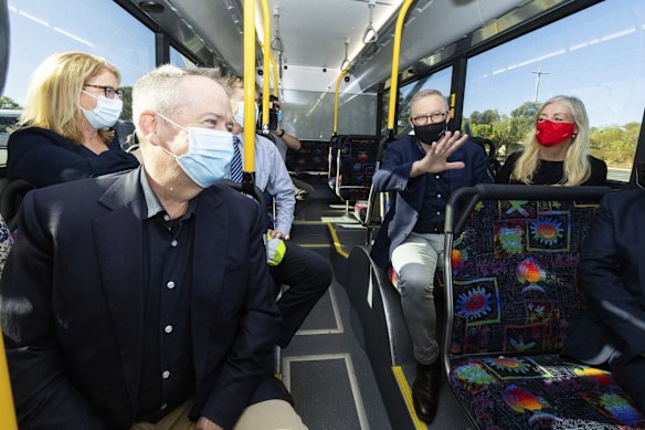 Shadow Minister for the National Disability Insurance Scheme Bill Shorten and Opposition Leader Anthony Albanese ride on an electric bus during a visit to the Swan Transit Joondalup Bus Depot, in Joondalup, WA, on Saturday 30 April 2022. 