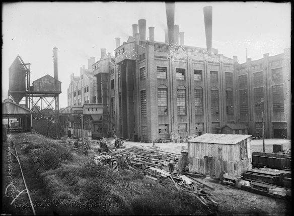 Piles of logs outside the White Bay Power House, Sydney, ca. 1920s.