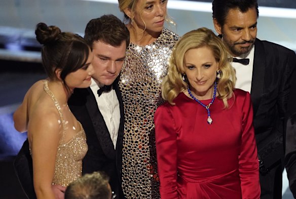 Emilia Jones, from left, Daniel Durant, Sian Heder, Marlee Matlin and Eugenio Derbez appear on stage to accept the award for best picture for "CODA".