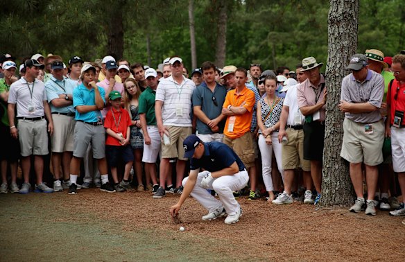 Jordan Spieth of the United States in the pine straw on the 11th.