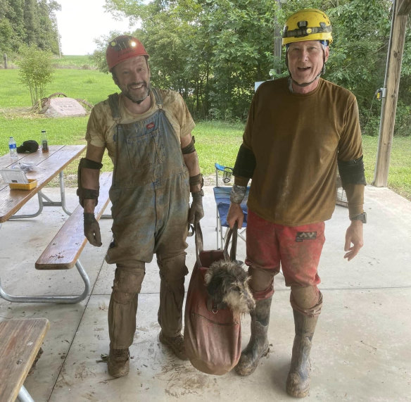 Gerry Keene, left, and Rick Haley with Abby after they rescued her from a Missouri cave.