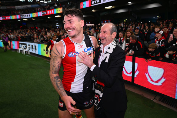 St Kilda president Andrew Bassat  embraces Josh Battle after the Saints’ win over Carlton on Sunday.