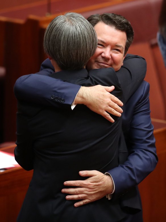 Senator Penny Wong is hugged by co-sponsor Senator Dean Smith after speaking on the Marriage Amendment Bill at Parliament House in Canberra on Thursday 16 November 2017. Fedpol. Photo: Andrew Meares