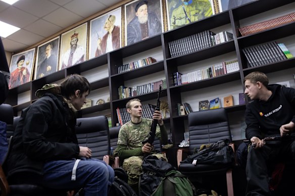 Volunteers receive weapons and training at a Territorial Defence depot in Kyiv.