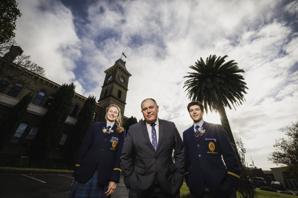 Dr Andrew Hirst, principal of Alexandra and Hamilton College in Hamilton, with boarders Grace Austin and Eren Zehir.