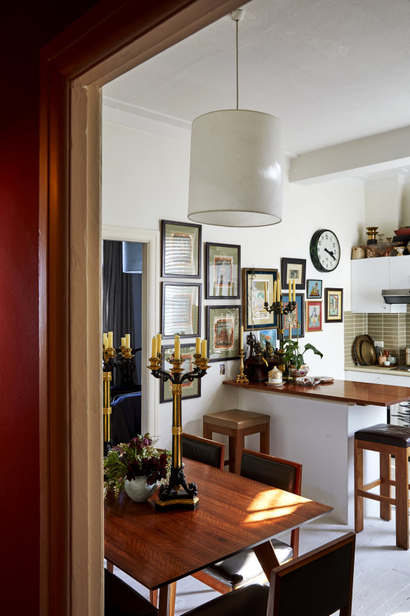 The spotted gum dining table is from Longmuir’s store, Planet, and the Georgian bronze candlesticks are from the UK. On the wall are antique artworks from India.
