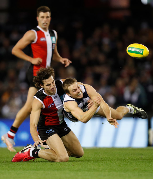 Geelong’s Tom Atkins is tackled by St Kilda’s Max King.