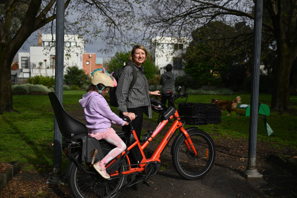 Salli Lloyd on her bike with her daughter Indigo.