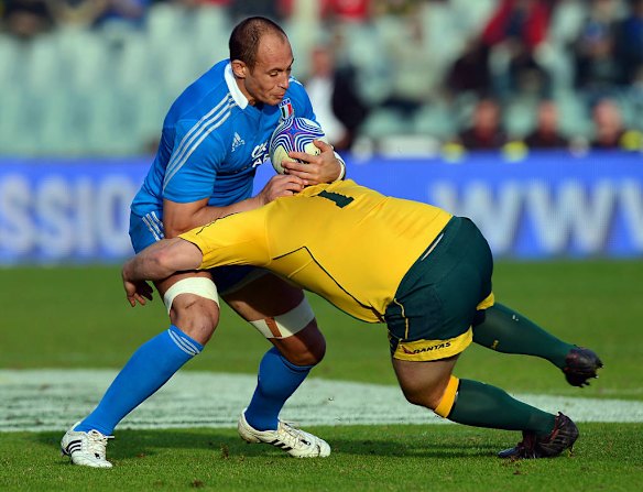 Sergio Parisse is tackled by Australia's prop Benn Robinson.