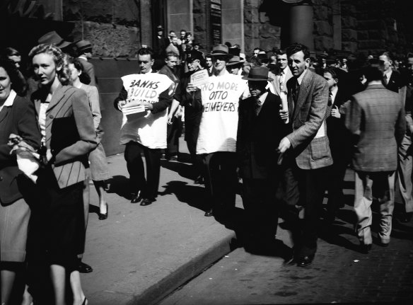 “Some of the demonstrators wore white smocks on which were printed slogans advocating nationalisation of the banks.”