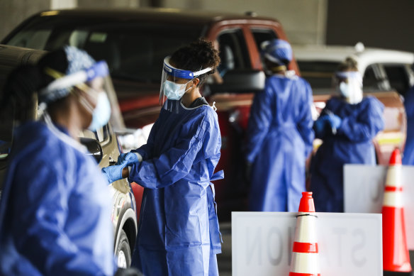 Healthcare workers at a COVID-19 testing site in in St Petersburg, Florida.