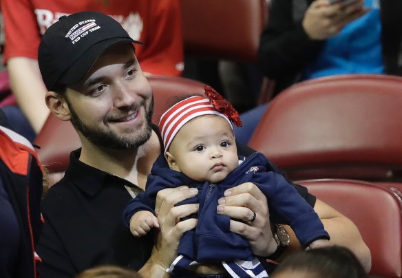 Alexis Ohanian, husband of Serena Williams, holds their baby, Alexis Olympia Ohanian Jr., before the doubles match in the first round of Fed Cup tennis competition in February.
