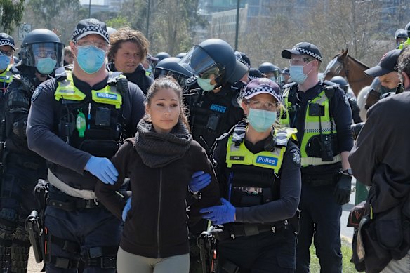 Photo of police keeping Anti lockdown protestors from continuing their rally in Albert Park in Saturday 5 September 2020. Photo Luis Enrique ascui 