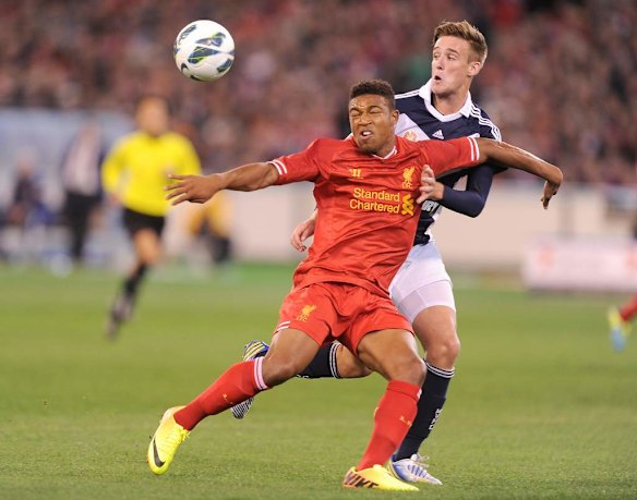 Liverpool's Jordon Ibe battles with  Nick Ansell.