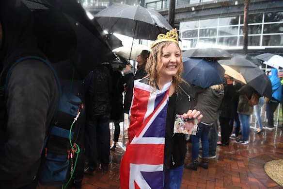 Prince Harry meets crowds at Campbell Cove, Circular Quay in very wet weather on June 7, 2017 in Sydney, Australia.