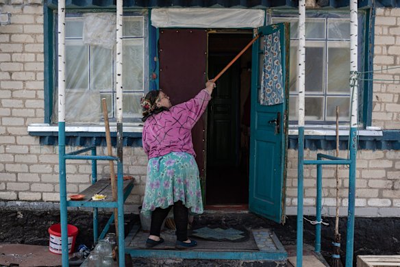 Nataliia Slukhai, 68, points to bullet holes in the door of her house in Zahaltsi. The towns around Kyiv are continuing a long road to what they hope is recovery, following weeks of brutal war as Russia made its failed bid to take Ukraine's capital.