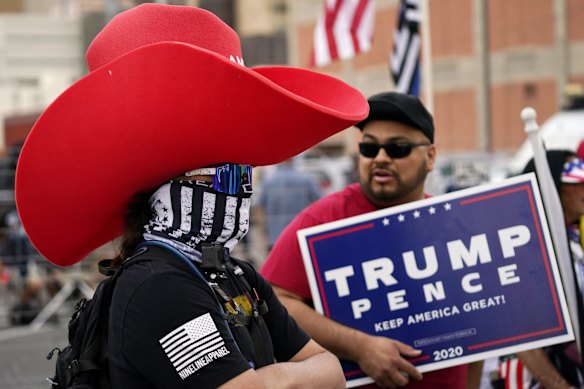Supporters of President Donald Trump rally outside the Maricopa County Recorder's Office,  in Phoenix. 